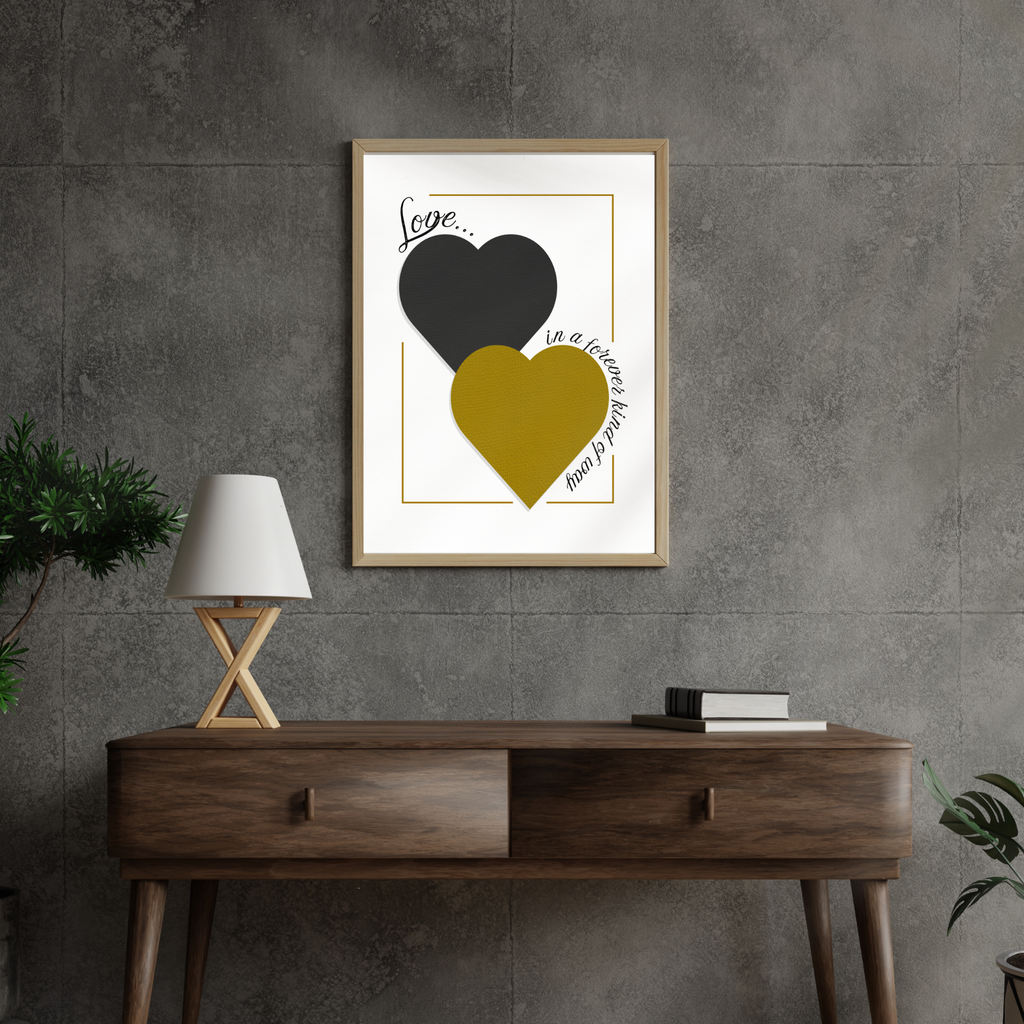 Framed artwork of Love Forever digital wall art with two hearts in black and gold on a grey wall above a wooden console table.
